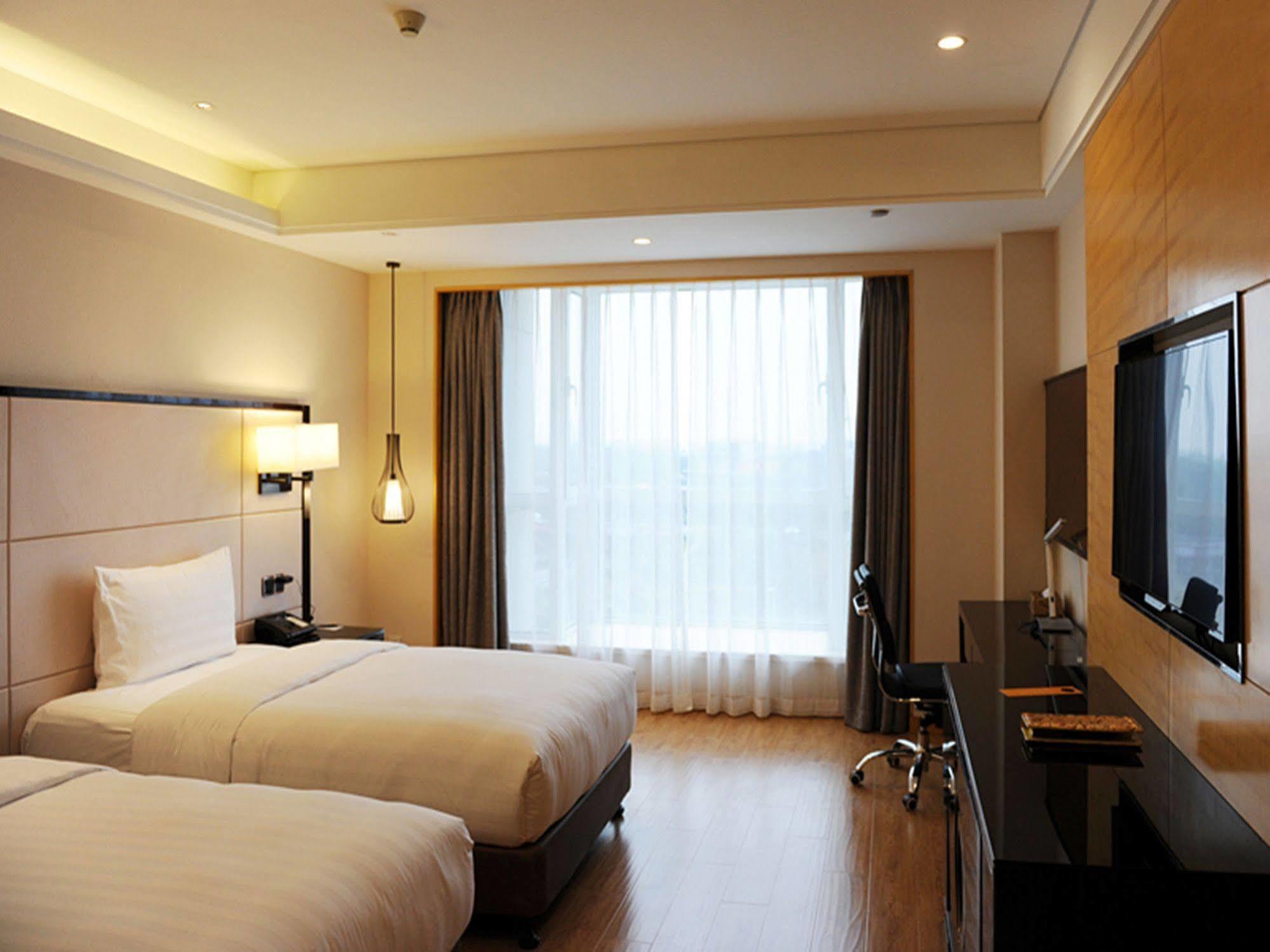 Pullman Qingdao Ziyue Hotel Buitenkant foto